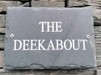 a sign on a wall that says the de registeroit at The Deekabout in Keswick