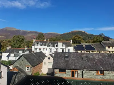a group of houses with solar panels on the roofs at Abacourt Cottage in Keswick