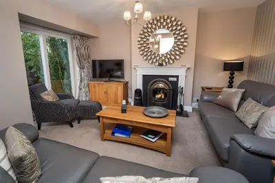 a living room with a couch and a table at Appletree in Portinscale
