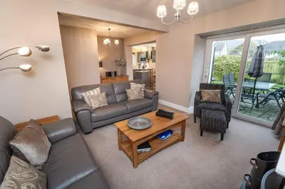 a living room with a couch and a table at Appletree in Portinscale