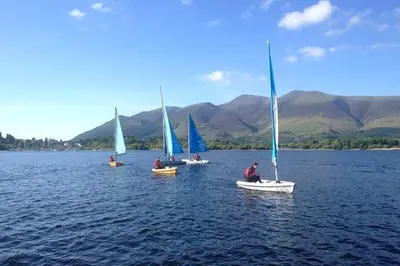 a group of sailboats in a large body of water at Tawny Cottage in Portinscale