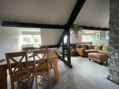 a living room with a table and chairs and a couch at Mountain View in Keswick