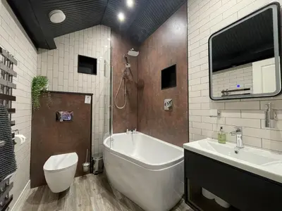 a bathroom with a tub and a toilet and a sink at Mountain View in Keswick
