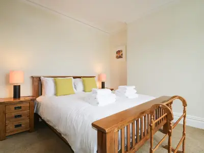 a bedroom with a large bed and a nightstand at Shields in Keswick