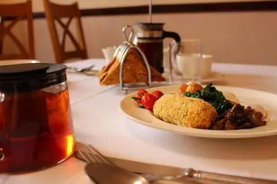 a plate of food on top of a table at Woodlands Country House & Cottage in Ireby