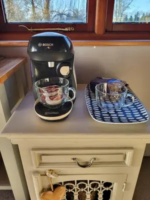 a mixer sitting on top of a table at Cosy wood cabin in rural area near national park in Cumnock