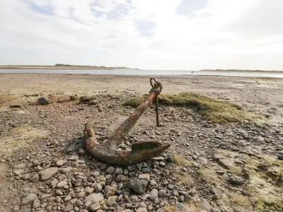 a piece of metal on a rocky beach at Waterside in Ravenglass