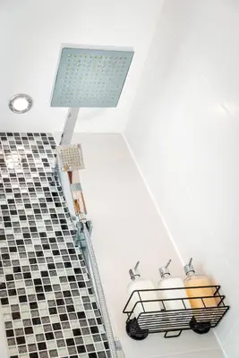 a light on the ceiling of a bathroom with a building at Luxury Studio Apartment - Town Centre in Whitehaven