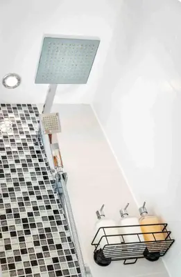 a bathroom with two sinks and a light on the ceiling at Luxury Studio Apartment - Town Centre in Whitehaven