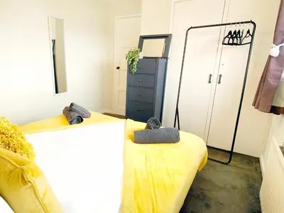 a bedroom with two twin beds and a dresser at Terrance House, modern, spacious in Carlisle