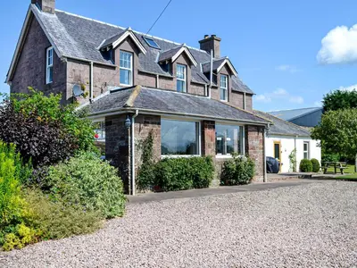 a house with a gravel driveway in front of it at Repentance View in Carrutherstown