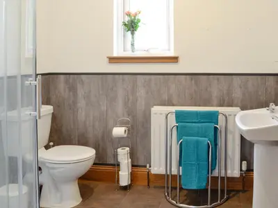 a bathroom with a toilet and a sink at Stronvaar in Stranraer