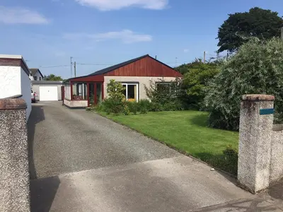 a house with a red roof and a driveway at Ardencaple No 2 in Castle Douglas