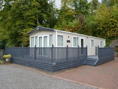 a small house with a fence and a gate at Graylings Rest - Uk35759 in Brigham