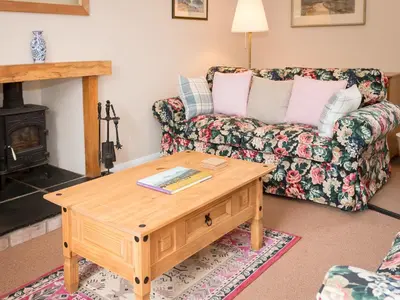 a living room with a couch and a coffee table at Uk35715 - South Cottage in Teviothead