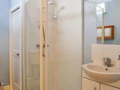 a bathroom with a shower and a sink at Sunnyside in New Galloway