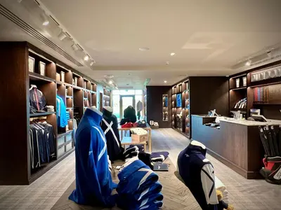 a dressing room with jackets and bags on the floor at Dundonald Links in Dreghorn