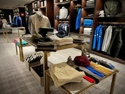 a clothing store with a lot of clothes on display at Dundonald Links in Dreghorn