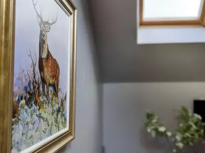 a picture of a painting of a deer on a wall at The Stables - Bankshill in Lockerbie