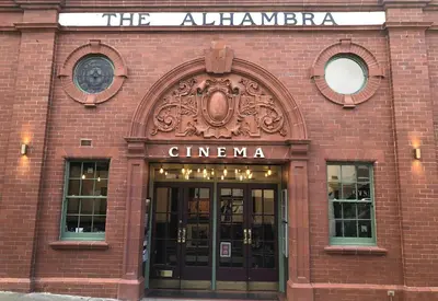a brick building with the entrance to a cinema at Gretaside in Keswick