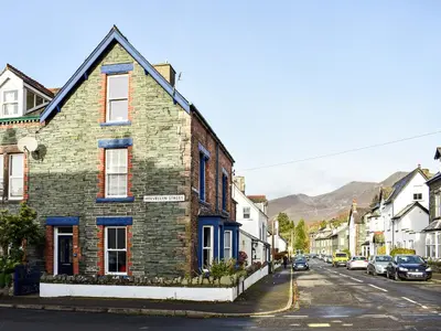 an old brick house on a city street at Upton Down in Keswick