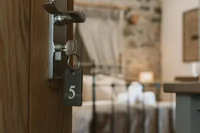 a door with a key in a room at Highside Farm in Bassenthwaite