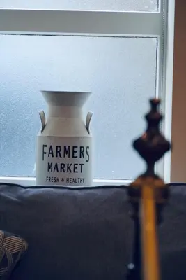 a white vase sitting in front of a window at Highside Farm in Bassenthwaite
