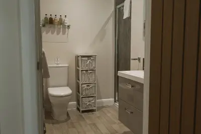 a bathroom with a toilet and a sink at Highside Farm in Bassenthwaite