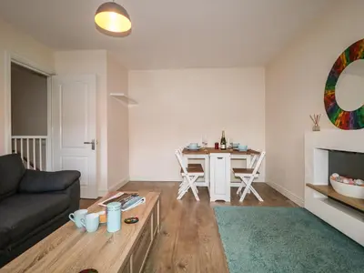 a living room with a couch and a table at Fox's Retreat in Keswick