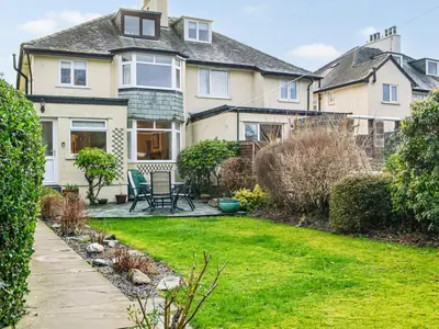 a house with a lawn in front of it at Parkfield in Keswick