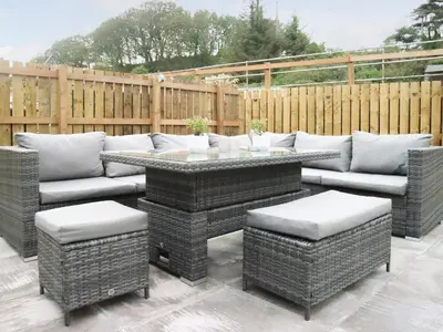 a patio with a couch and a table and chairs at 2 Mote View- Uk37496 in Sandhead
