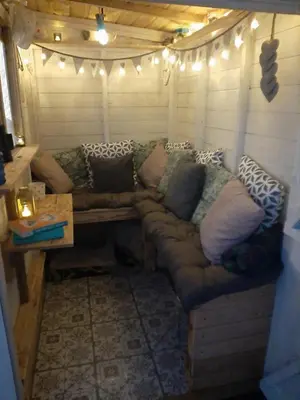 a living room with a couch in a tent at Stunning Riverside Town House with views Ayrshire in Girvan