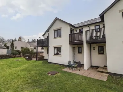 an image of a house with a yard at Tilly Mint Cottage in Penrith