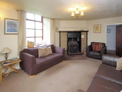 a living room with two couches and a fireplace at The Coach House - Uk38000 in Kirkcowan