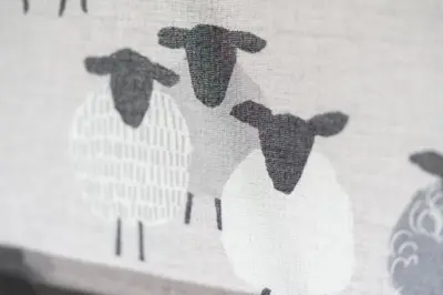 a close up of a curtain with four birds on it at Rhubarb Cottage in Chapel Stile