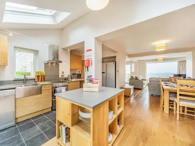 a kitchen and living room with a table in it at Fairview in Keswick
