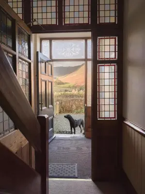 a dog standing in the doorway of a house at Yewthwaite Newlands Keswick in Keswick