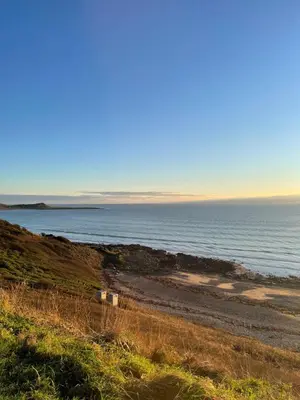 a beach with the ocean in the background at Beautiful 2-Bed Static caravan in Newton Stewart