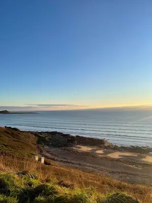 a beach with the ocean in the background at Beautiful 2-Bed Static caravan in Newton Stewart