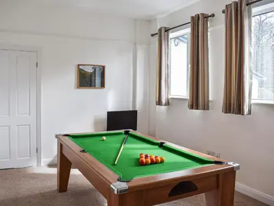 a room with a pool table with balls on it at Littlethwaite in Keswick