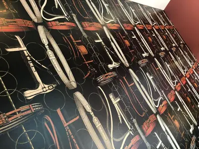 a bunch of scissors hanging on a wall at Masonic Arms Gatehouse in Gatehouse of Fleet