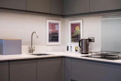 a kitchen with a sink and a counter top at Howe Keld 3 Ground floor in Keswick