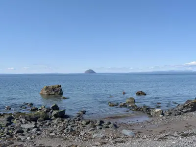 a large body of water with rocks in it at Seal Rocks in Lendalfoot