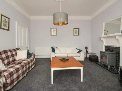 a living room with a couch and a coffee table at Willowbank in Ayr