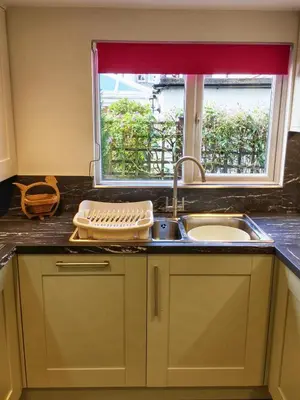 a kitchen counter with a sink and a window at Felltop Cottage in Keswick