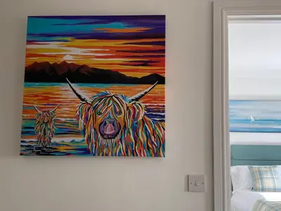 a painting of two cows in the water at Beachcomber in Garlieston