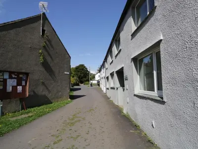 an empty alleyway next to a building at Ashness in Keswick