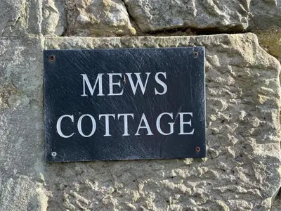 a sign that says news conference on a stone wall at House - Sleeps 4 Pet Friendly & Free Parking in Symington