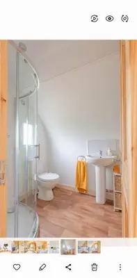 a bathroom with a shower and a toilet and a sink at The Galloway Steading- The Bee Hive Couples Retreat with Hot Tub and Fire Pit in Glenluce