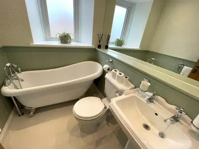 a bathroom with a tub and a toilet and a sink at Beautifully Presented 3BR Luxury Apartment - Pass the Keys in Kirkcudbright